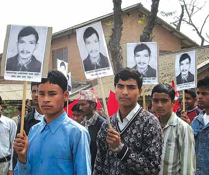 Students in Dang hold placards in a rally depicting photos of Umesh Thapa who was killed by security force in the Feb 8 municipal day in Dang.
