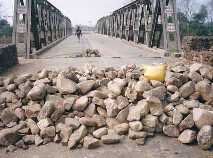Maoists put stones and logs on Daldale Bridge at Butwal-Narayanghat section of Mahendra Highway.