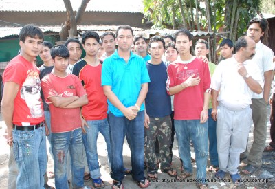 nepalis at german bakery, pune, india