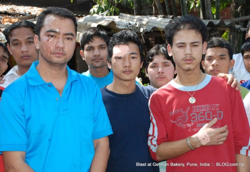 injured nepalis at german bakery, pune, india