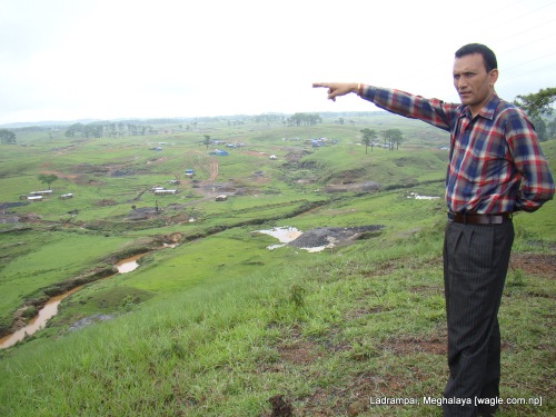 Ramesh Deuja, a sardar at one of the coal mines in Ladrampai in Meghalaya, points out towards the shacks where Nepali labourers stay.