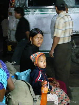A kid and his mother: India bound- expecting to earn living that Nepal, their country, couldn't provide. At the bus stand in Banbasa, Indian town bordering far west Nepal