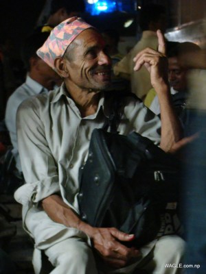 An Old Man: India bound- expecting to earn living that Nepal, their country, couldn't provide. At the bus stand in Banbasa, Indian town bordering far west Nepal