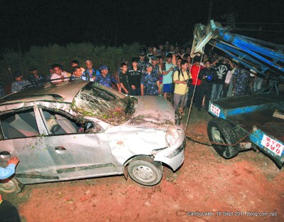 british embassy compound wall collapses over a car in kathmandu