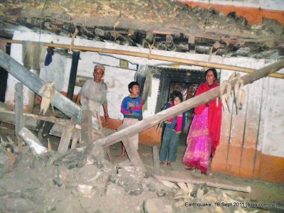 A family in Taplejung- shaken by the earthquake that damaged their home