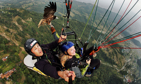 In Nepal, Gliding With a Feathered Guide
