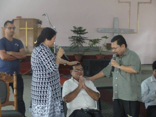 Krishna Bahadur Mahara receives much needed blessings from a pastor KB Basel of the Gospal Assembly Church in Nepalgunj on 27th July.